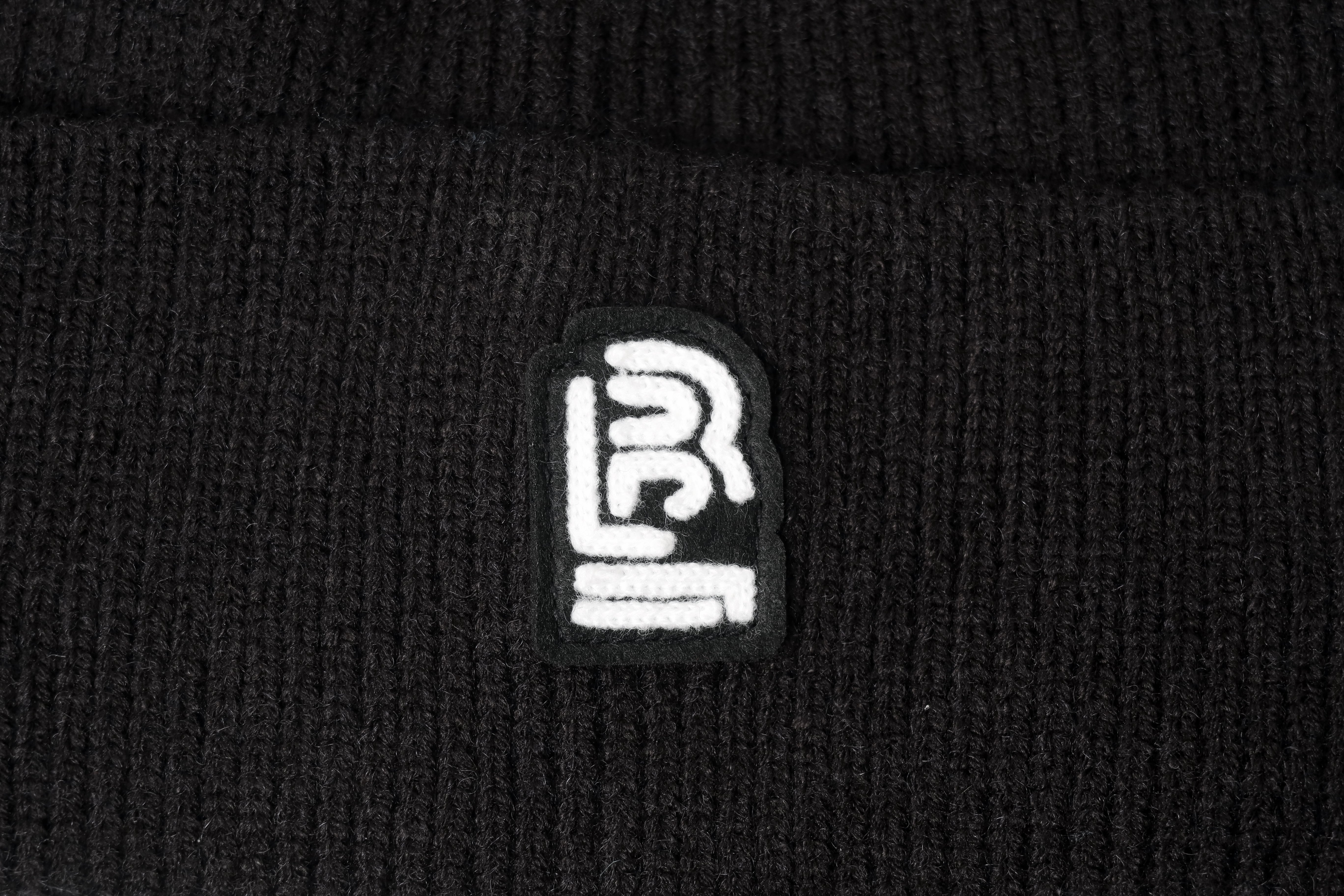 A black Blackwing Wool Beanie with a white Blackwing logo.