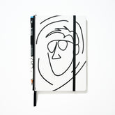 Blackwing x AEW "Freshly Squeezed" Orange Cassidy Notebook with a minimalist black line drawing of a face on a white cover