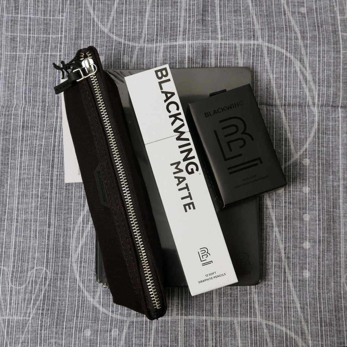 A Blackwing Furoshiki with a book and pencil A Blackwing Furoshiki with a book and pencil