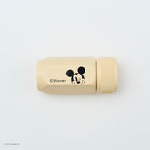 A beige cylindrical Blackwing Disney pencil sharpener with a black Mickey Mouse face graphic and the Disney copyright text, shown on a clean white background.