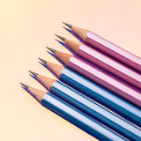 A row of Blackwing Pearl - Pink (Set of 12) pencils on a pink background.