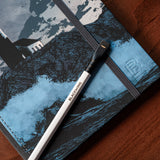 A Blackwing Artist Series Slate Notebook - Andrea Sorrentino & Jeff Lemire with a Blackwing pencil and a lighthouse on it.