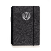 A Blackwing Artist Series Slate Notebook with Florian Bertmer's art - grey and black notebook with white imprint of a circle of snakes
