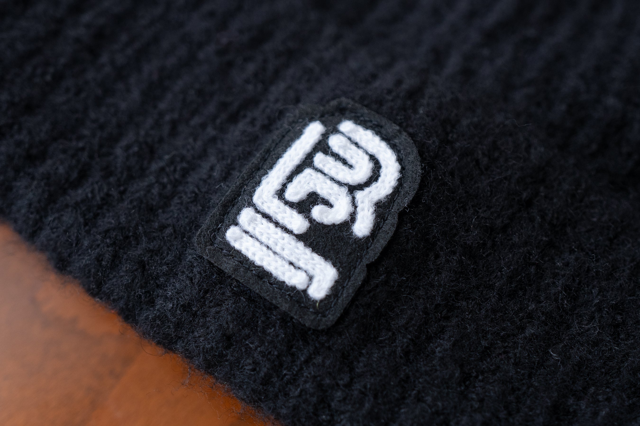 A Blackwing Wool Beanie with a black Blackwing logo, made in the USA.