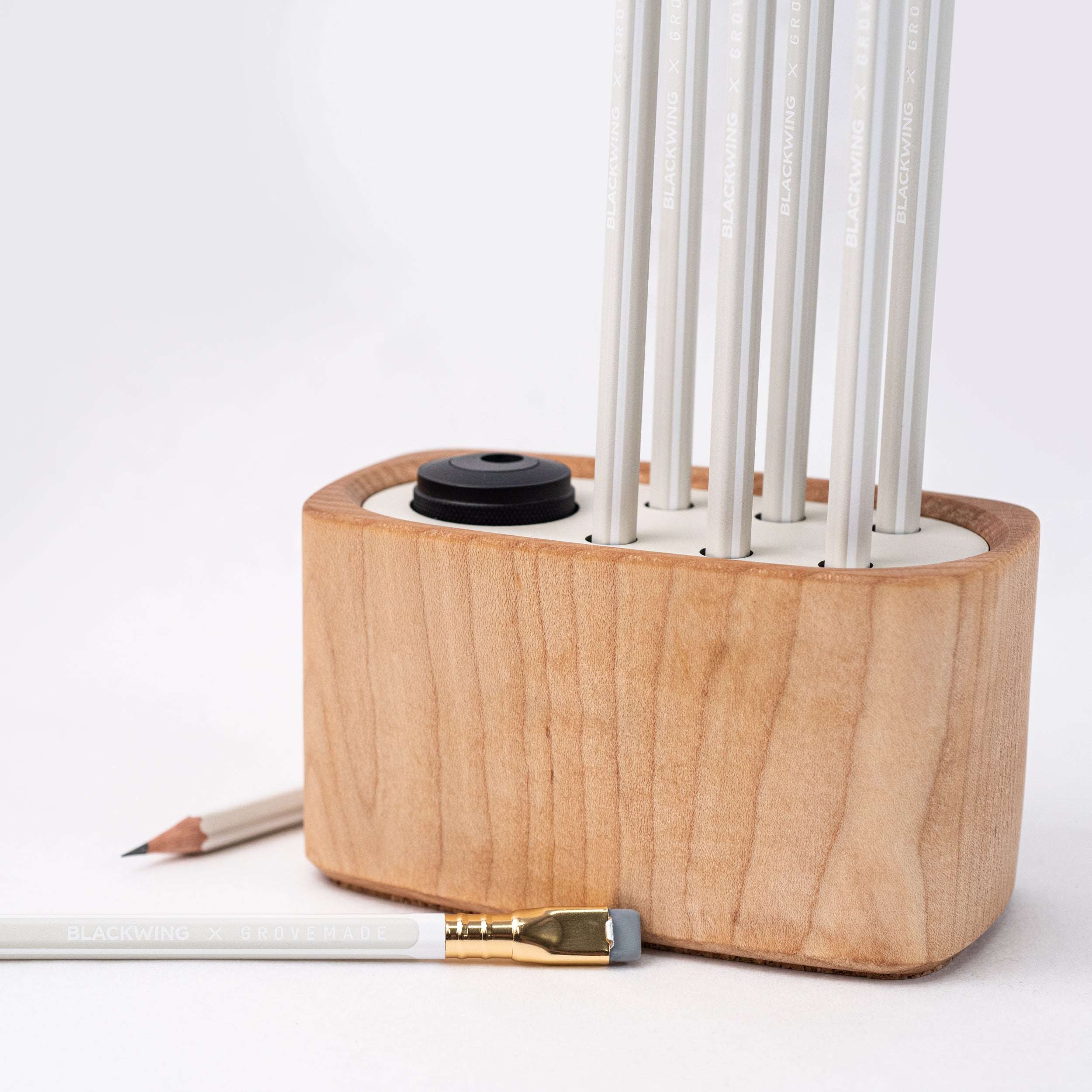 A Blackwing x Grovemade Desktop Caddy Kit - Maple with pencils.