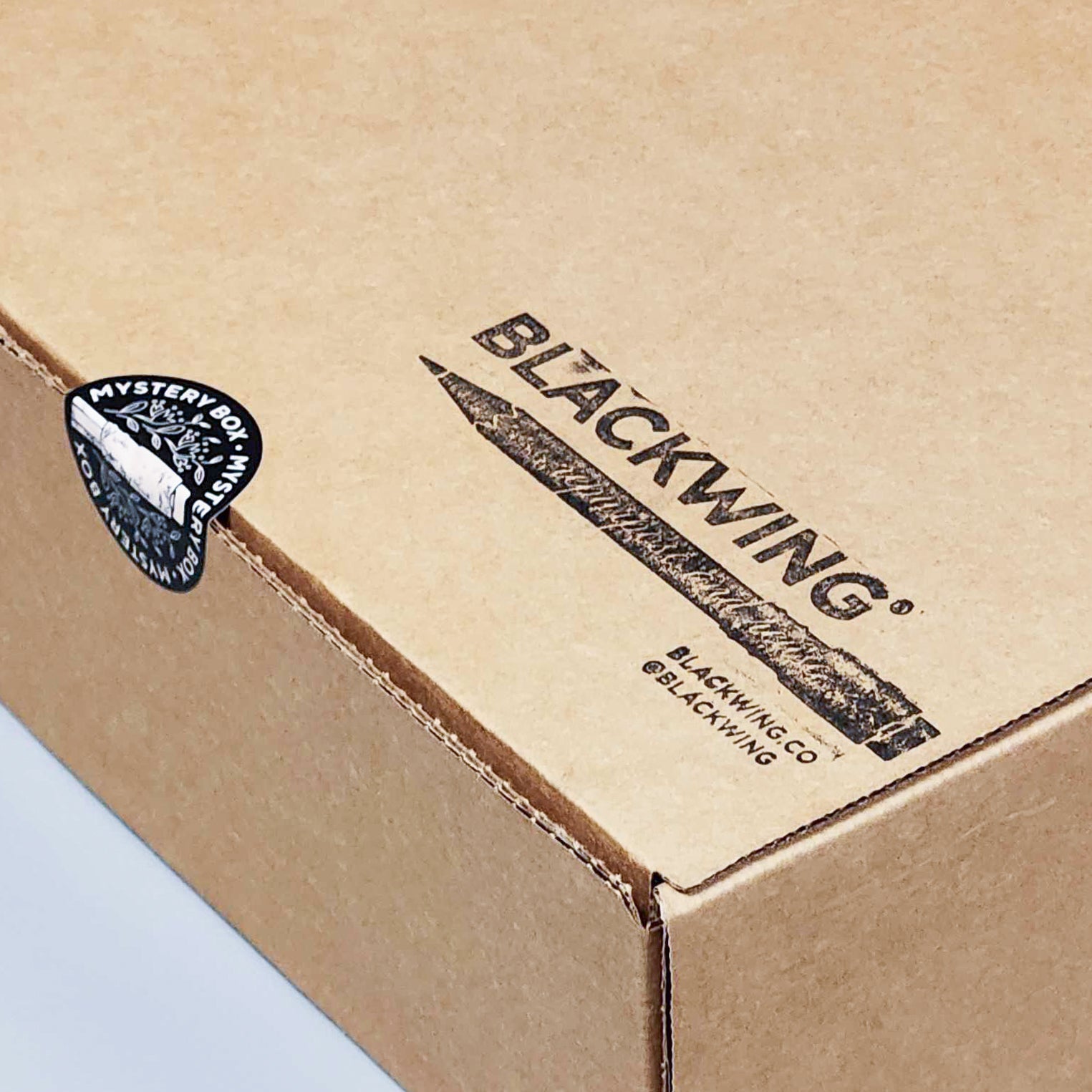A Blackwing Mystery Box with a Blackwing logo, perfect for pencil enthusiasts who love a bit of mystery.