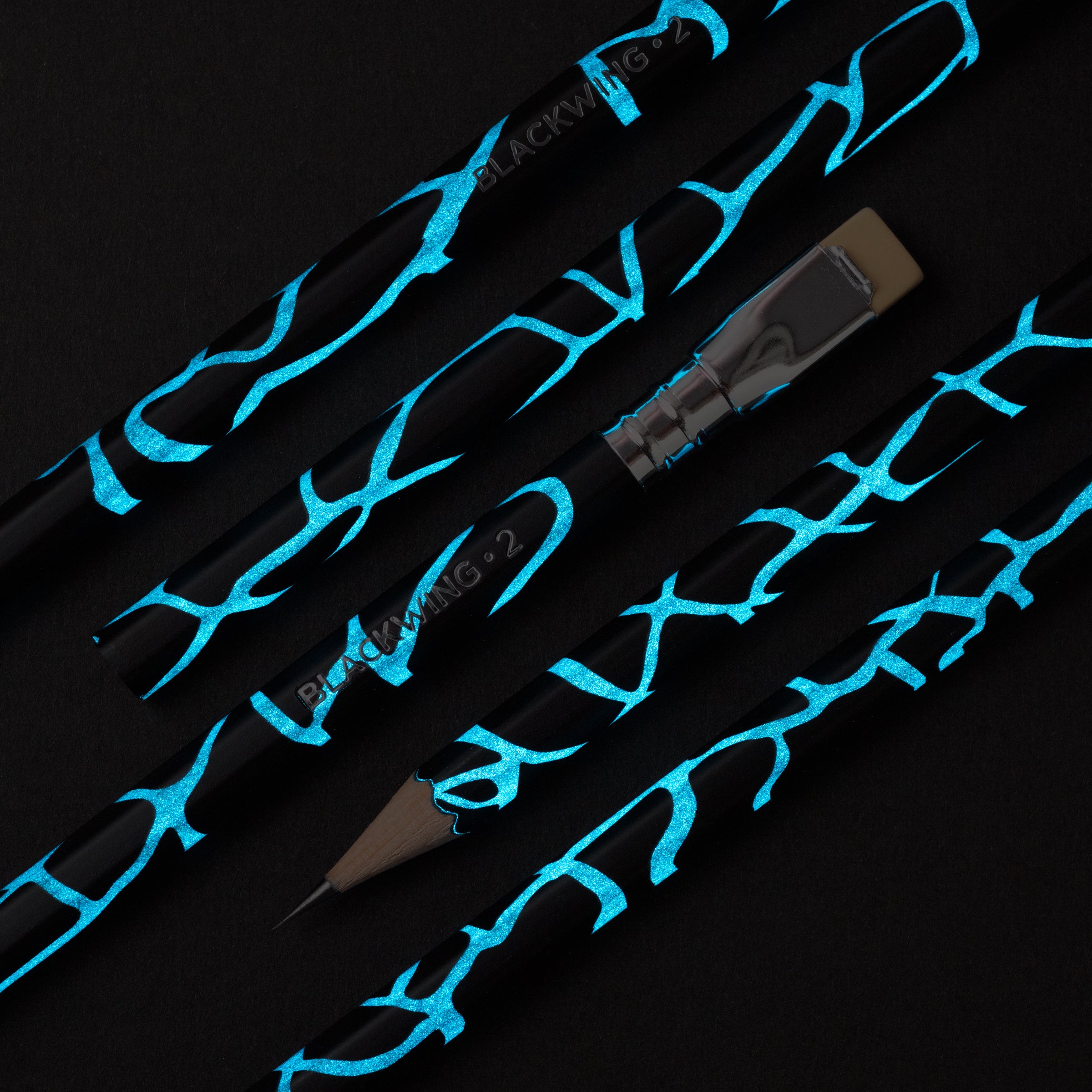 A set of Blackwing Volume 2 pencils with artistic blue designs.