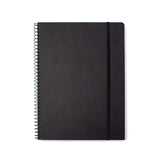 A Blackwing spiral notebook sits on a white background.