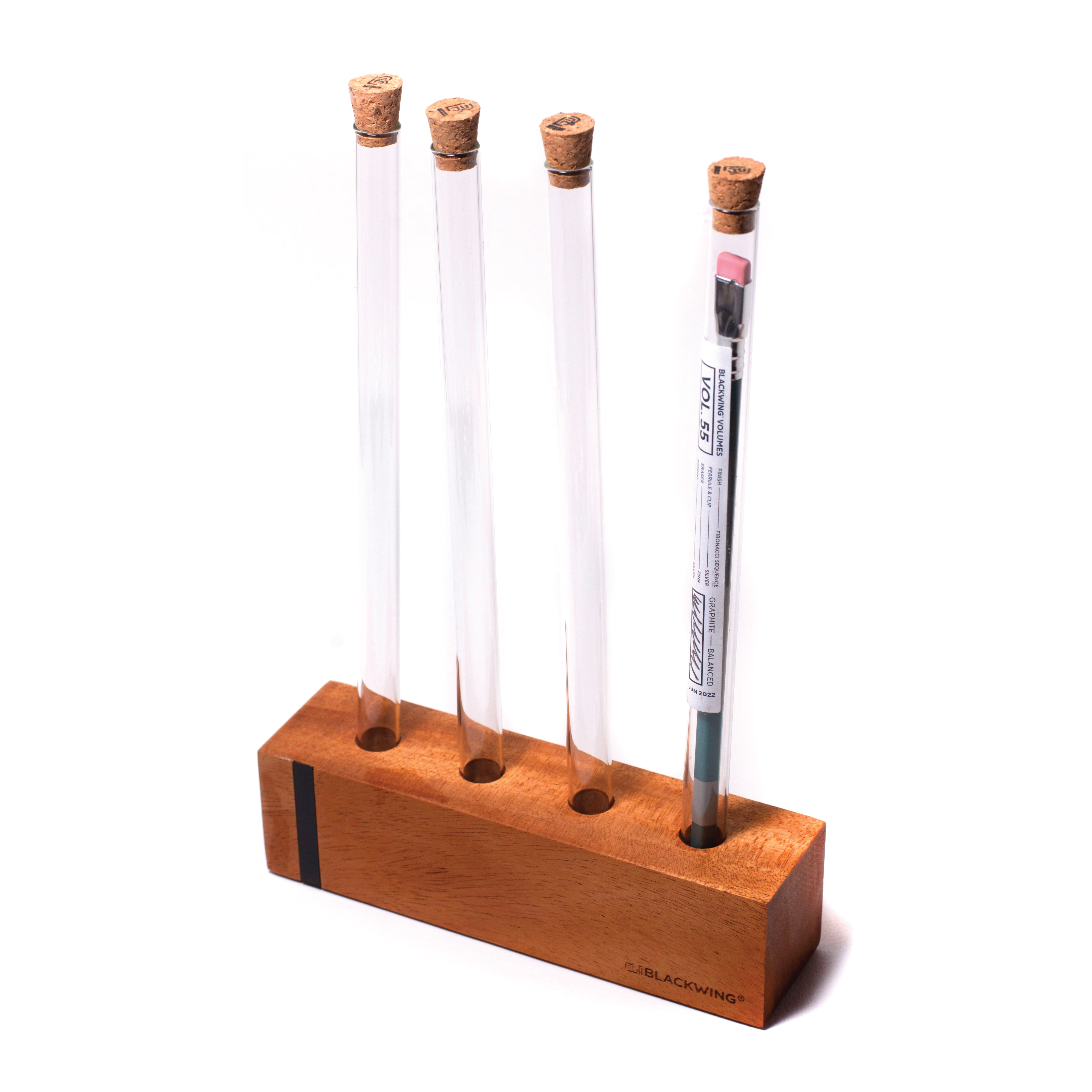 A wooden pencil holder displaying three Blackwing Upright Four Tube Display pencils.
