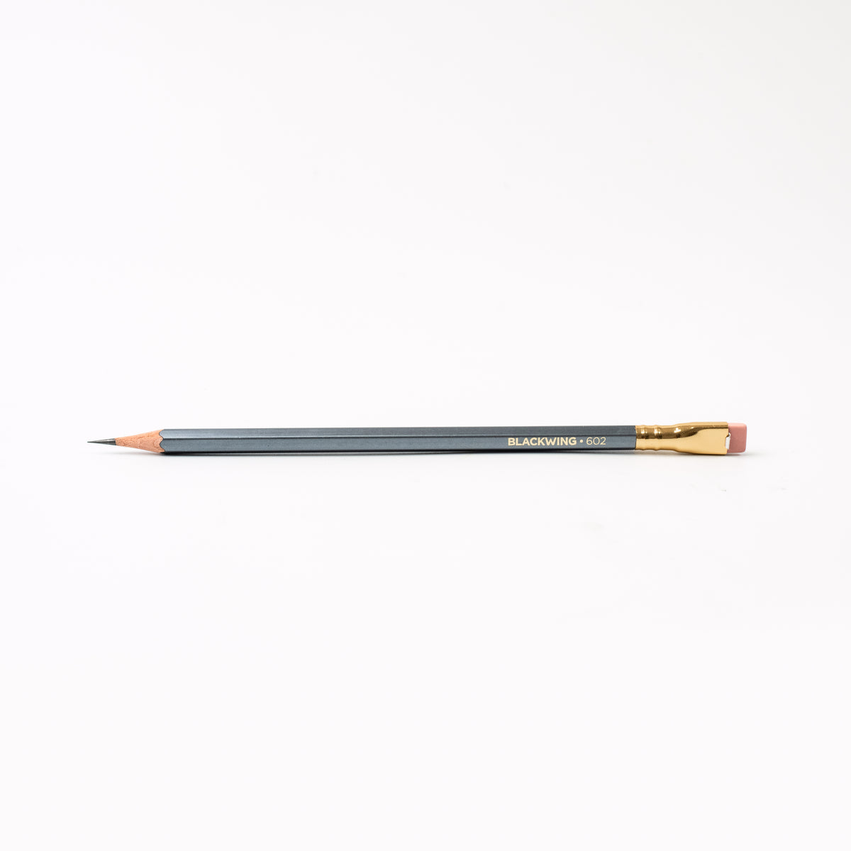 A Blackwing 602 (Set of 12) pencil is resting on a white surface.