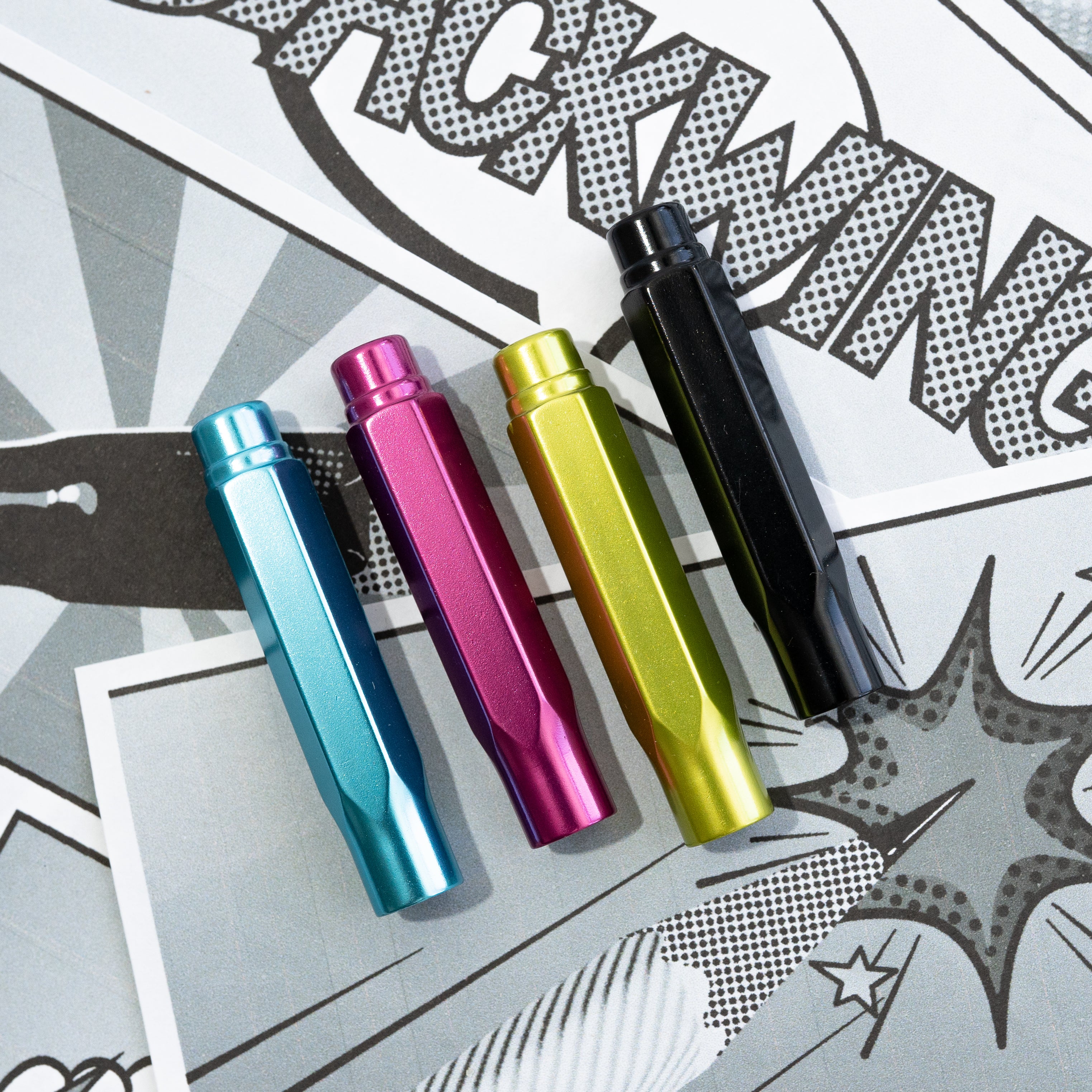 Four colorful Blackwing Volume 64 Point Guards (Set of 4) mechanical pencils lying on a graphic print surface.