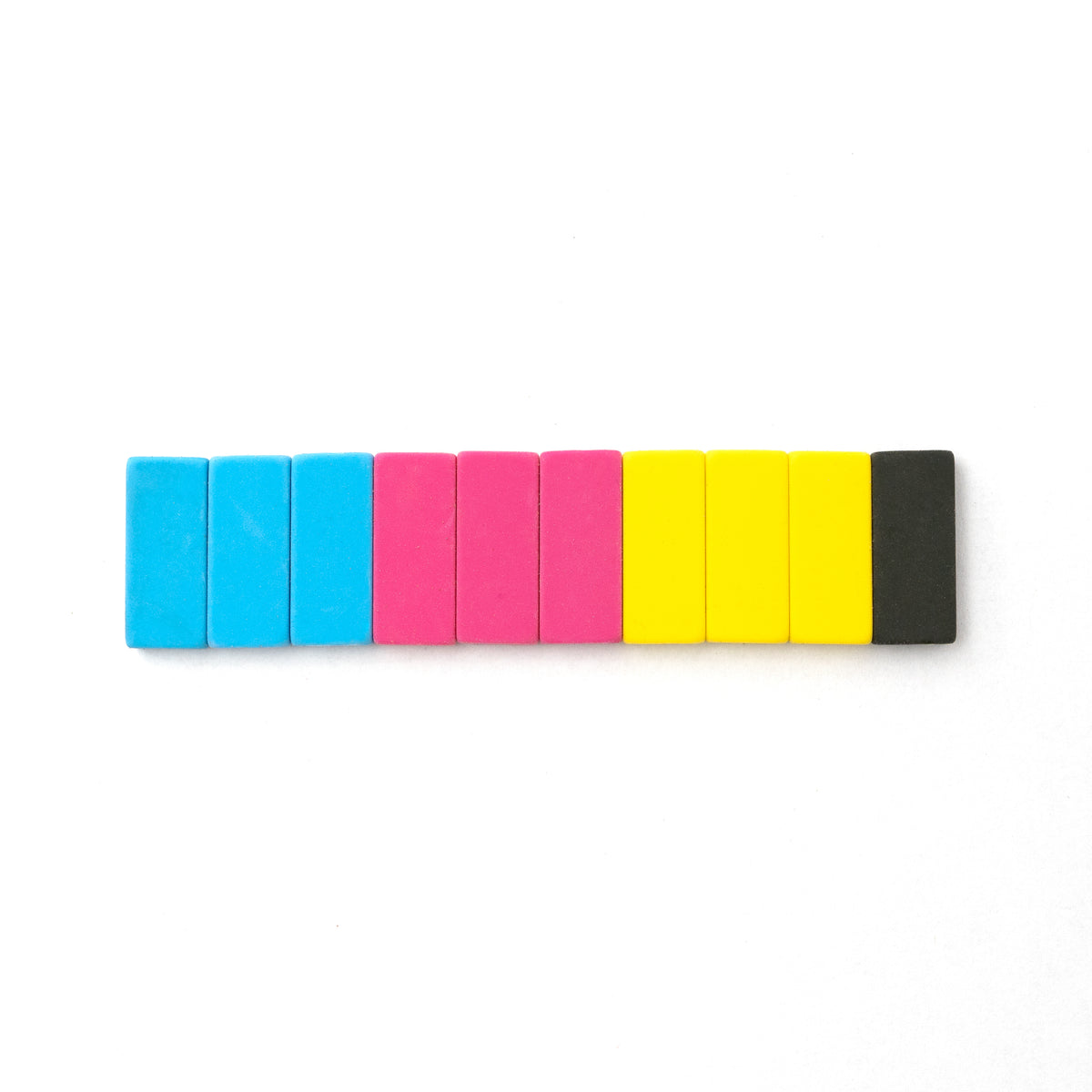 A row of colorful rectangular erasers arranged in a gradient from blue to Blackwing Volume 64 Replacement Erasers on a white background.
