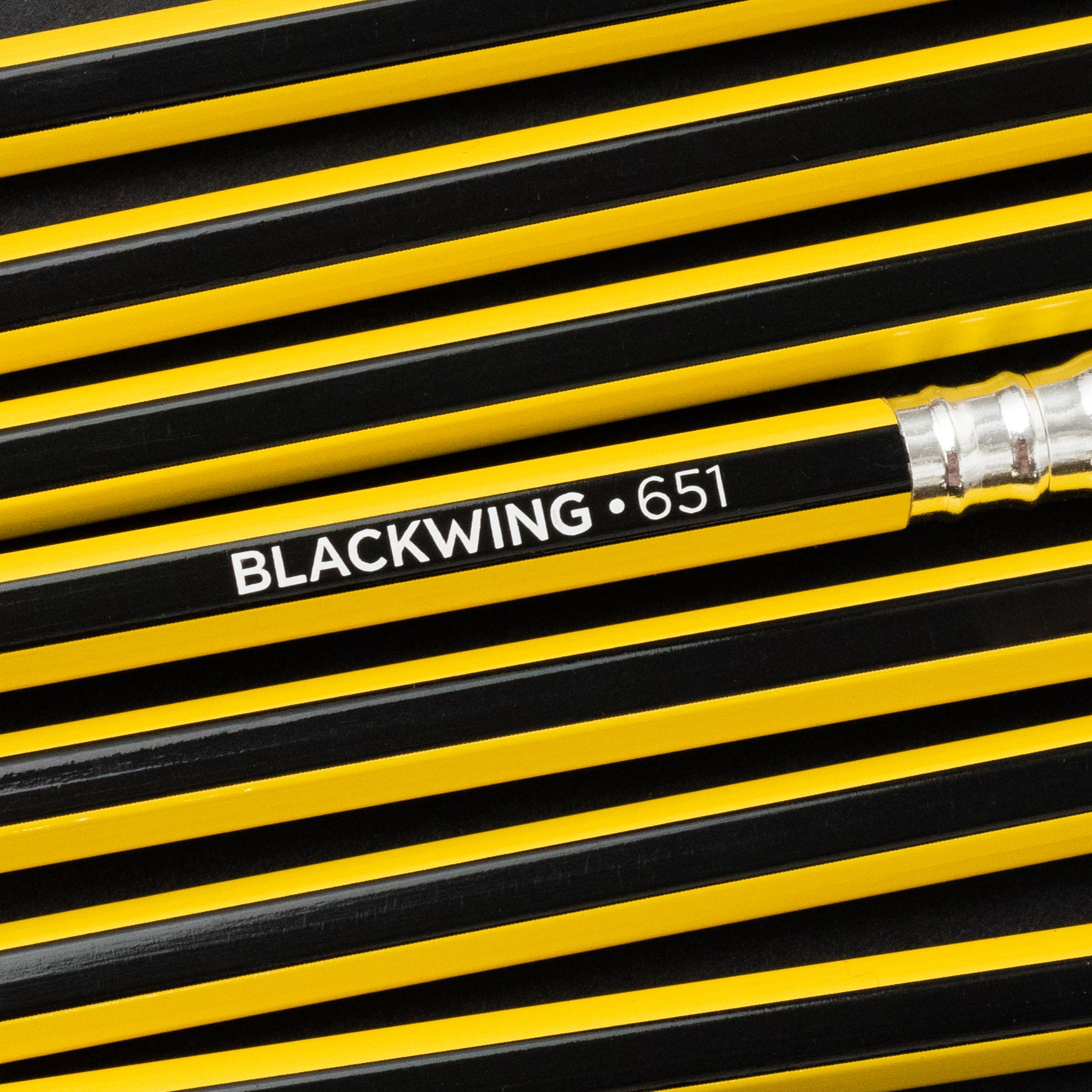 A group of Blackwing Volume 651 (Set of 12) pencils with the word blackwing on them, inspired by Bruce Lee.