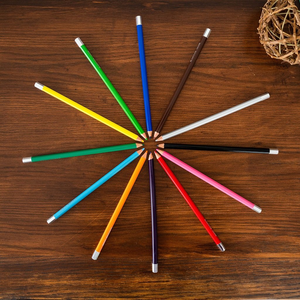 Blackwing Colors (Set of 12) arranged in a circle on a wooden table, perfect for coloring enthusiasts.
