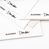 A stack of Blackwing Volumes Notecards - Year 2, with black writing on it.