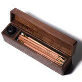 A Blackwing Walnut Box with Blackwing pencils in it.