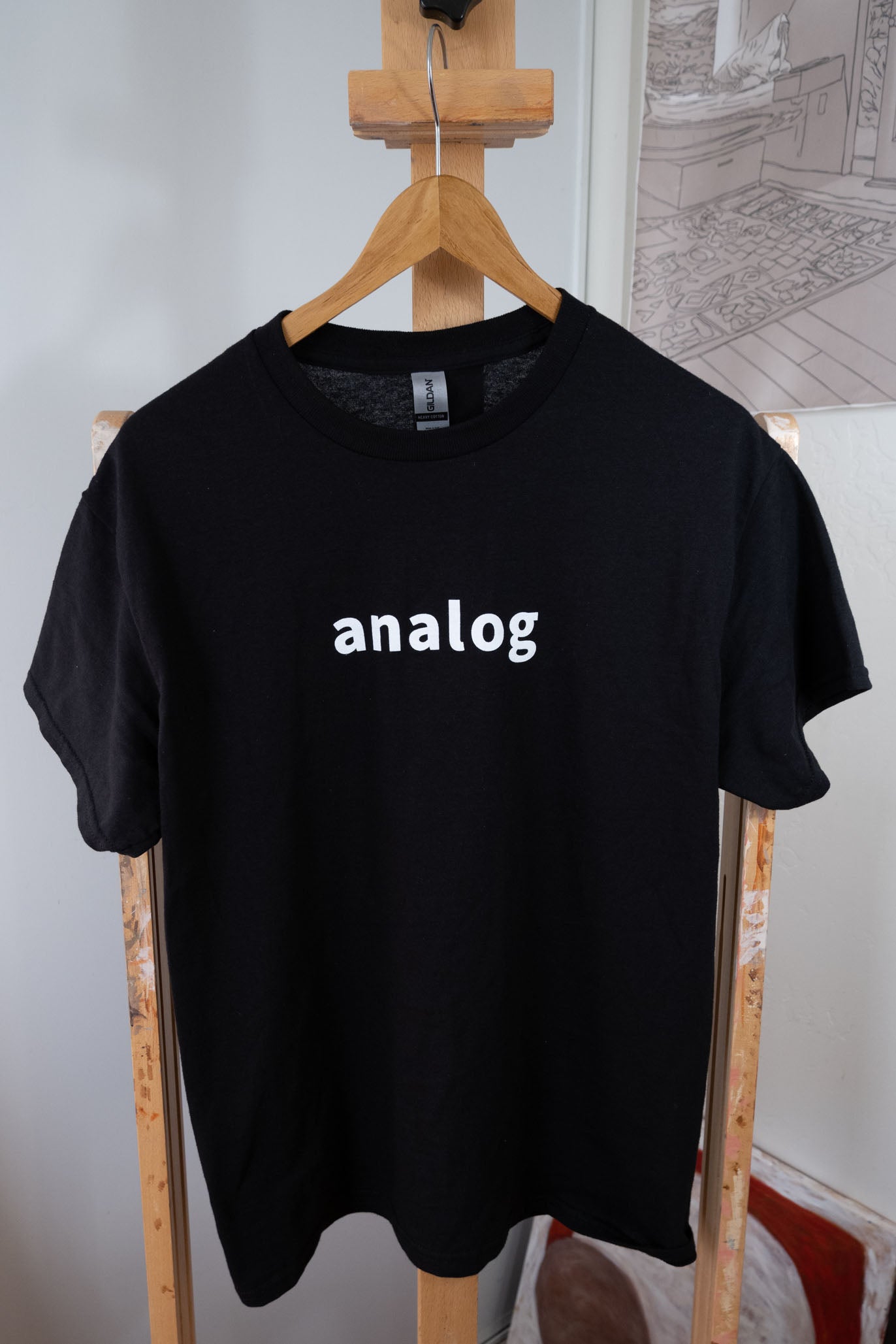 A black shirt on an Analog T-Shirt pencil.