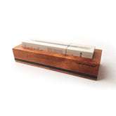 A wooden box with a Blackwing Flat Box Display in it.