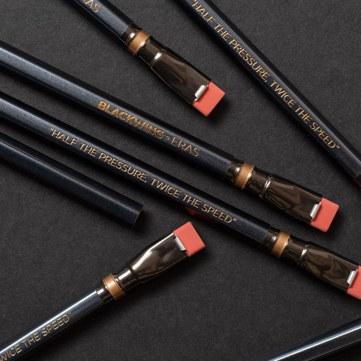 Blackwing Eras have a dark grey barrel, iconic dark grey ferrule with a gold stripe, dark gold imprint, red eraser, and our extra-firm graphite. Blackwing Eras have a dark grey barrel, iconic dark grey ferrule with a gold stripe, dark gold imprint, red eraser, and our extra-firm graphite.