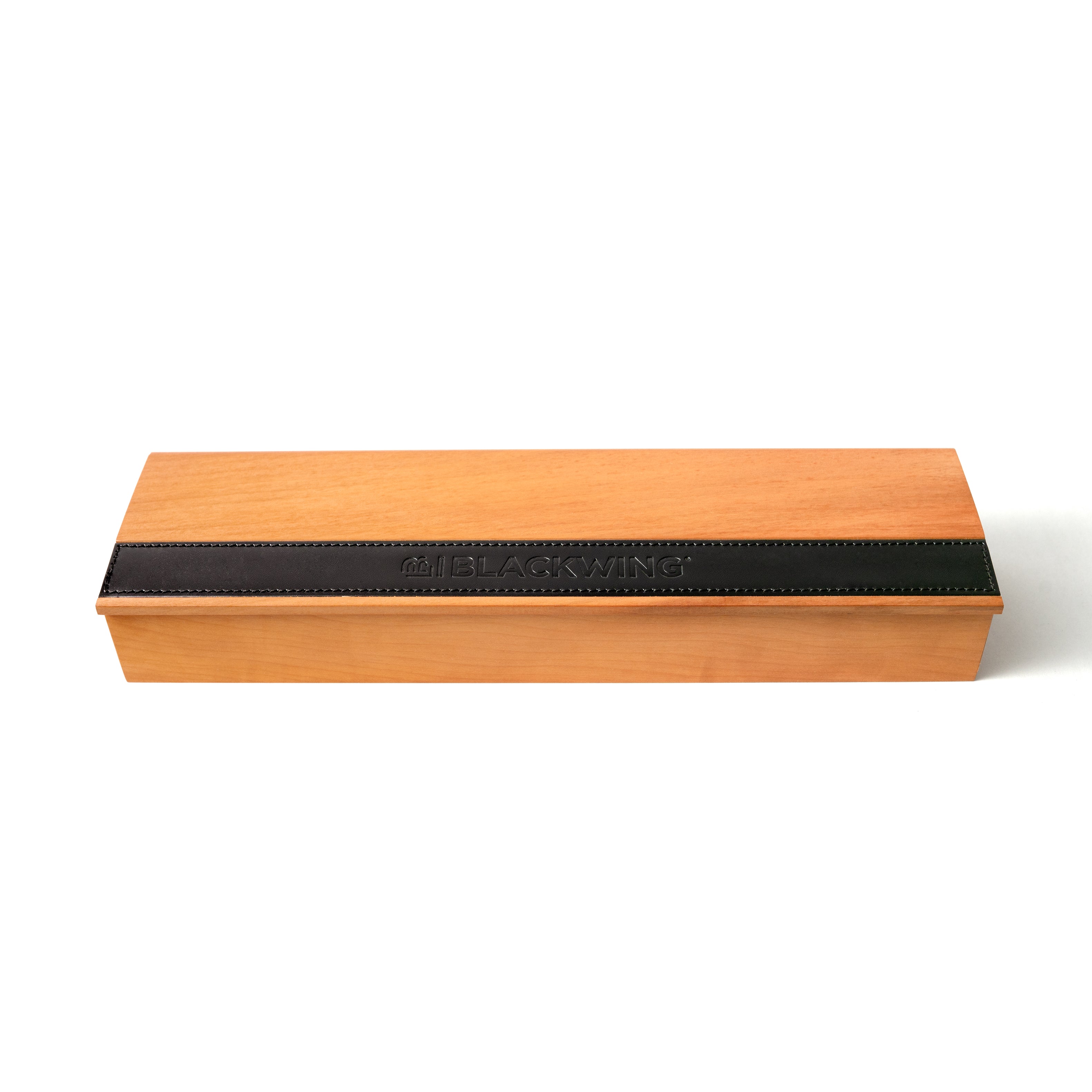 A wooden box with a black stripe, containing Blackwing French Wood Box pencils.