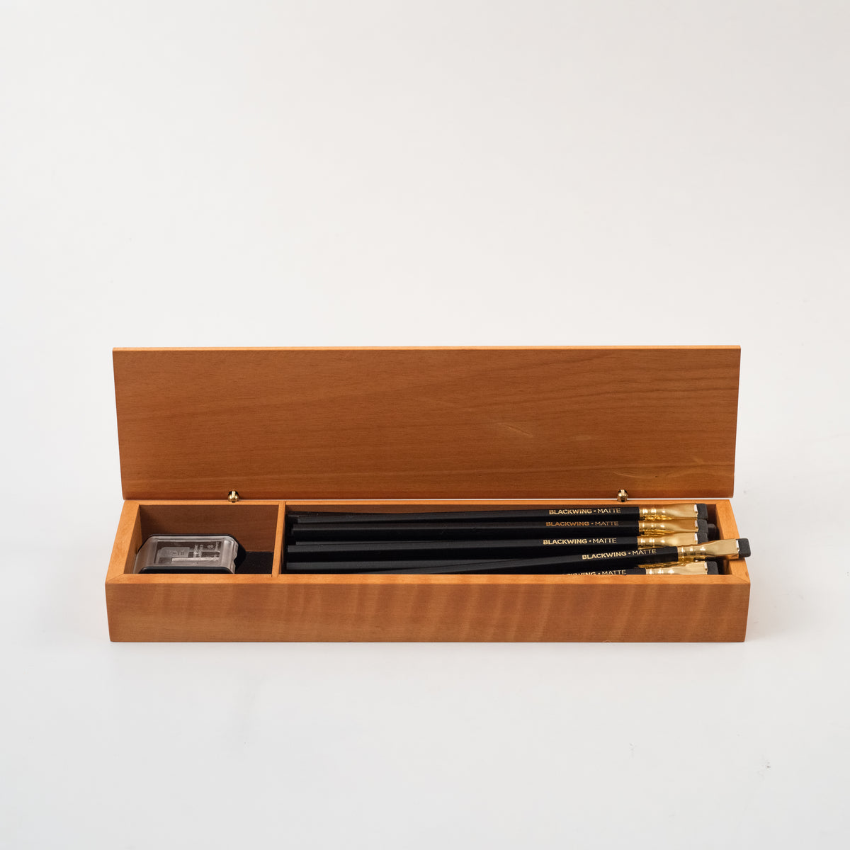 A set of Blackwing French Wood Box pencils in a wooden box.