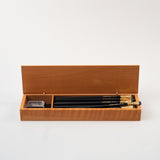 A set of Blackwing French Wood Box pencils in a wooden box.