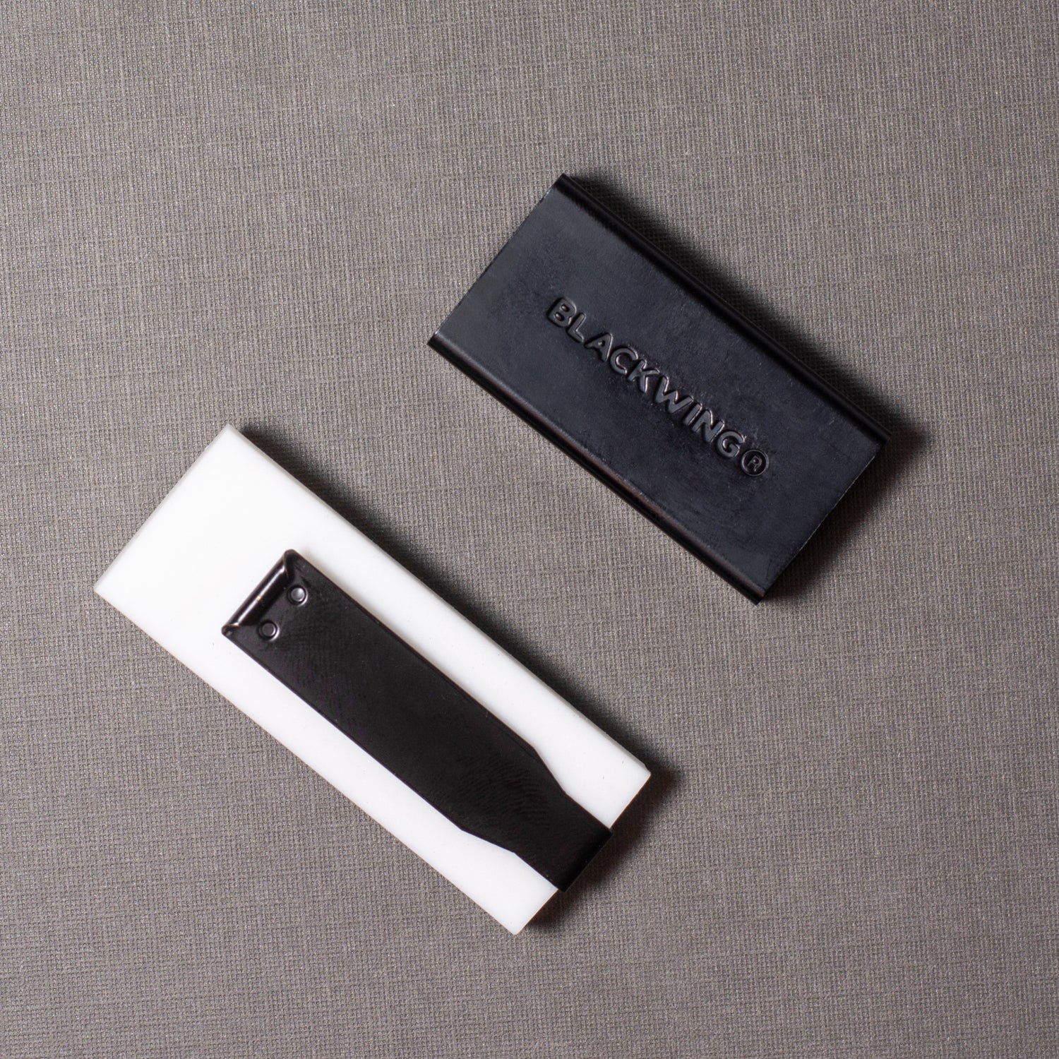 A rectangular object in black and white with a Blackwing Handheld Eraser Replacements - Set of 3.