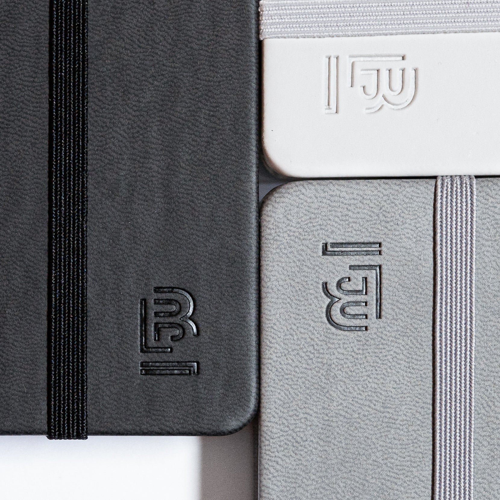 A black Small Blackwing Slate Notebook - White with a logo on it.