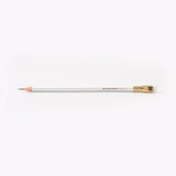 A Blackwing Pearl pencil with a graphite core on a white surface.