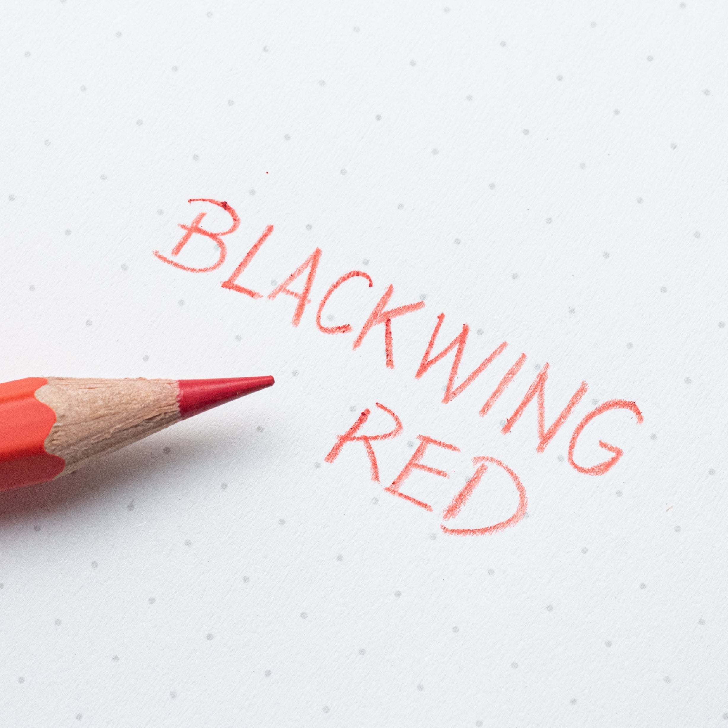 A red pencil with the Blackwing Red (Set of 4) written on it, perfect for sketching or editing.