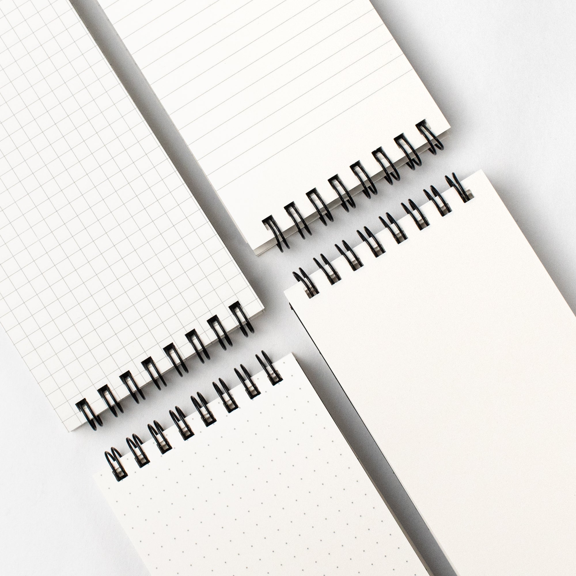 Three Blackwing Reporter Pads (Set of 2) for sketching and note-taking on a white surface.