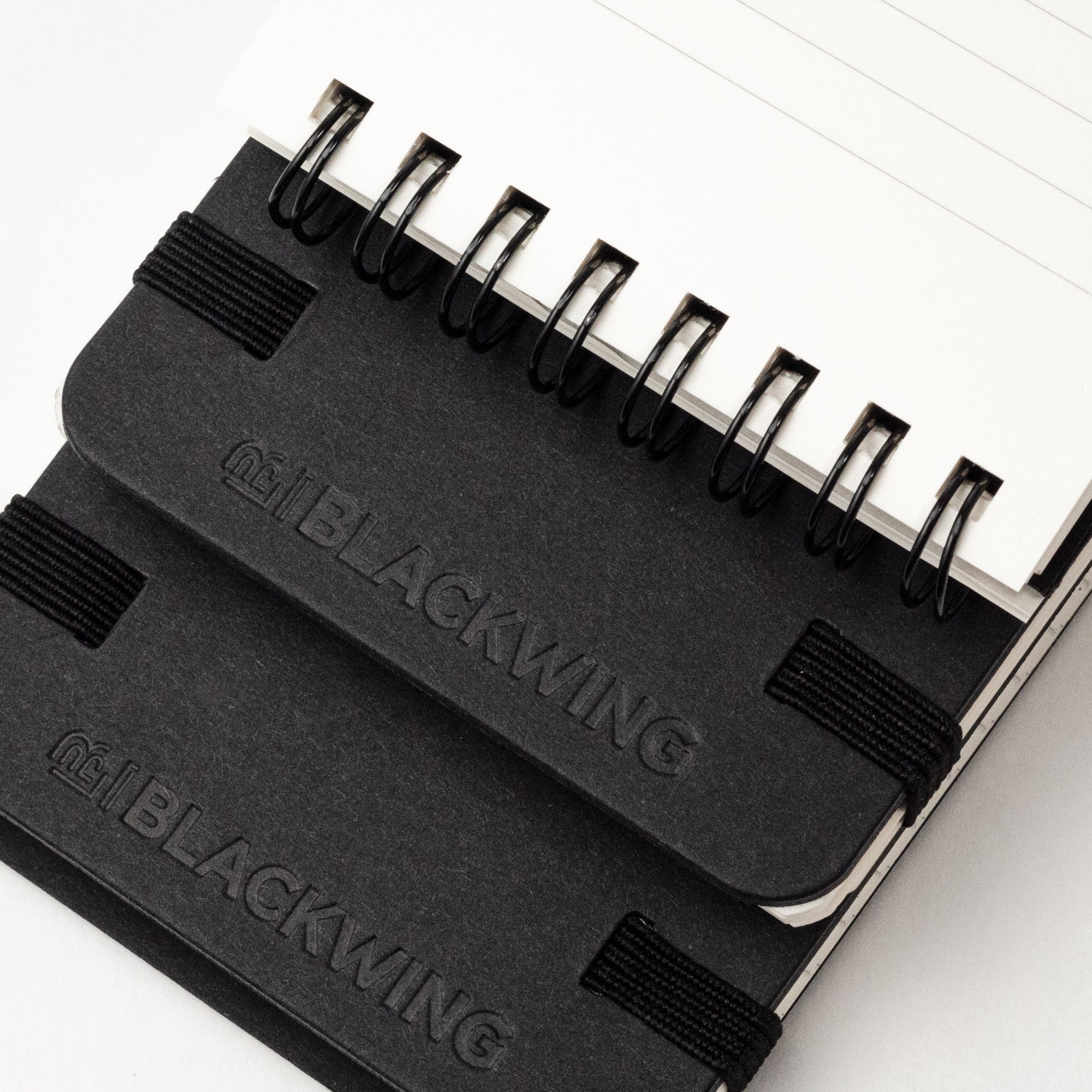 A Blackwing Reporter Pads (Set of 2) with the black king logo on it, perfect for note-taking or sketching.