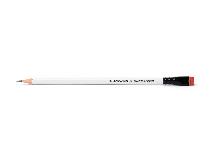 A Blackwing x Timeless Coffee Slate Notebook with a Blackwing pencil peeking out, against a white background. A Blackwing x Timeless Coffee Slate Notebook with a Blackwing pencil peeking out, against a white background.