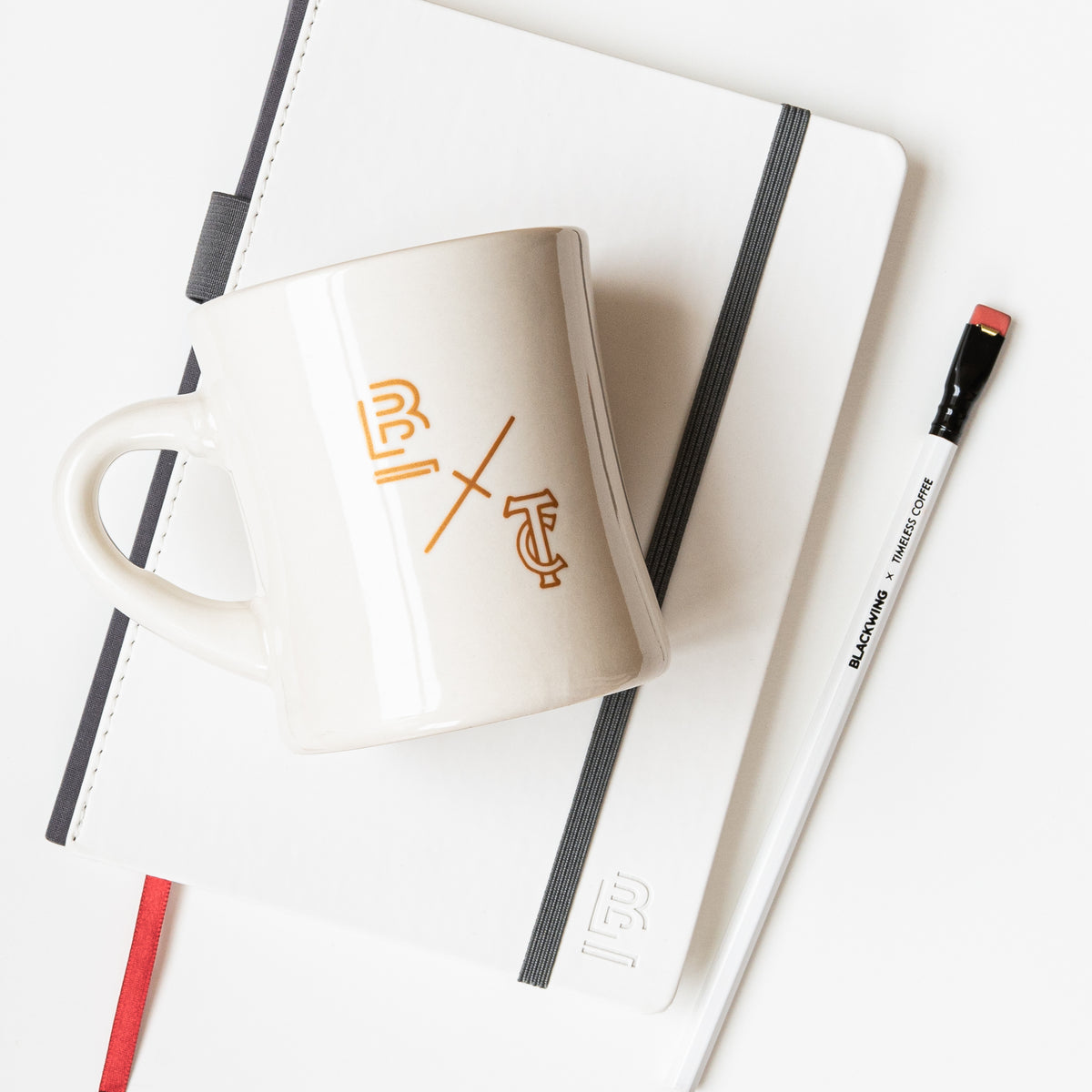 A Blackwing x Timeless Coffee Bundle with a notebook beside it.