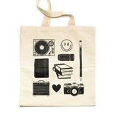 canvas tote with Blackwing pencil and analog graphics on it in black