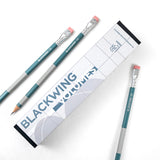 Blackwing Volume 55 (Set of 12) pencils in a box sit on a white surface, showcasing perfect symmetry.
