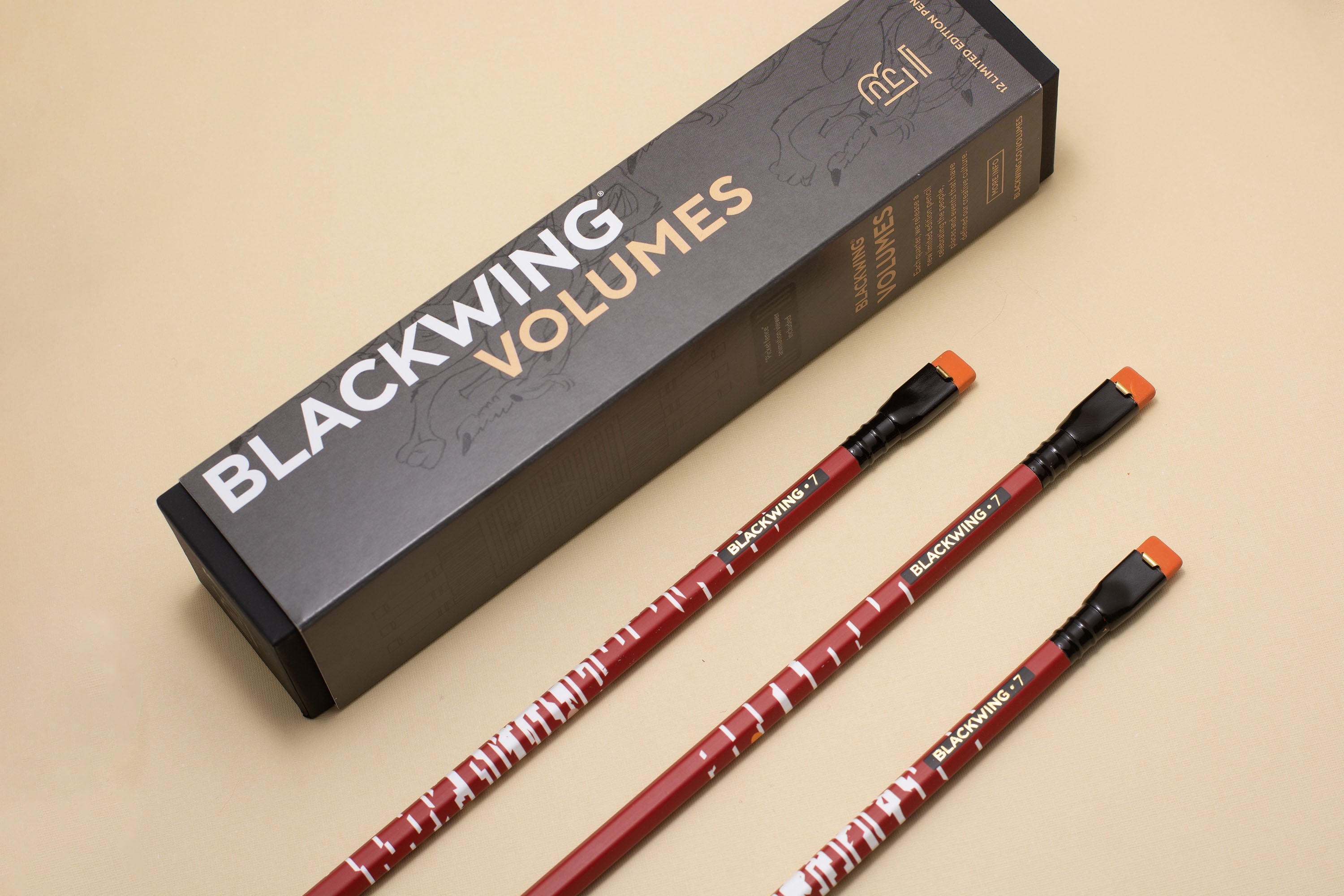 Two Blackwing Volume 7 (Set of 12) pencils next to a box.