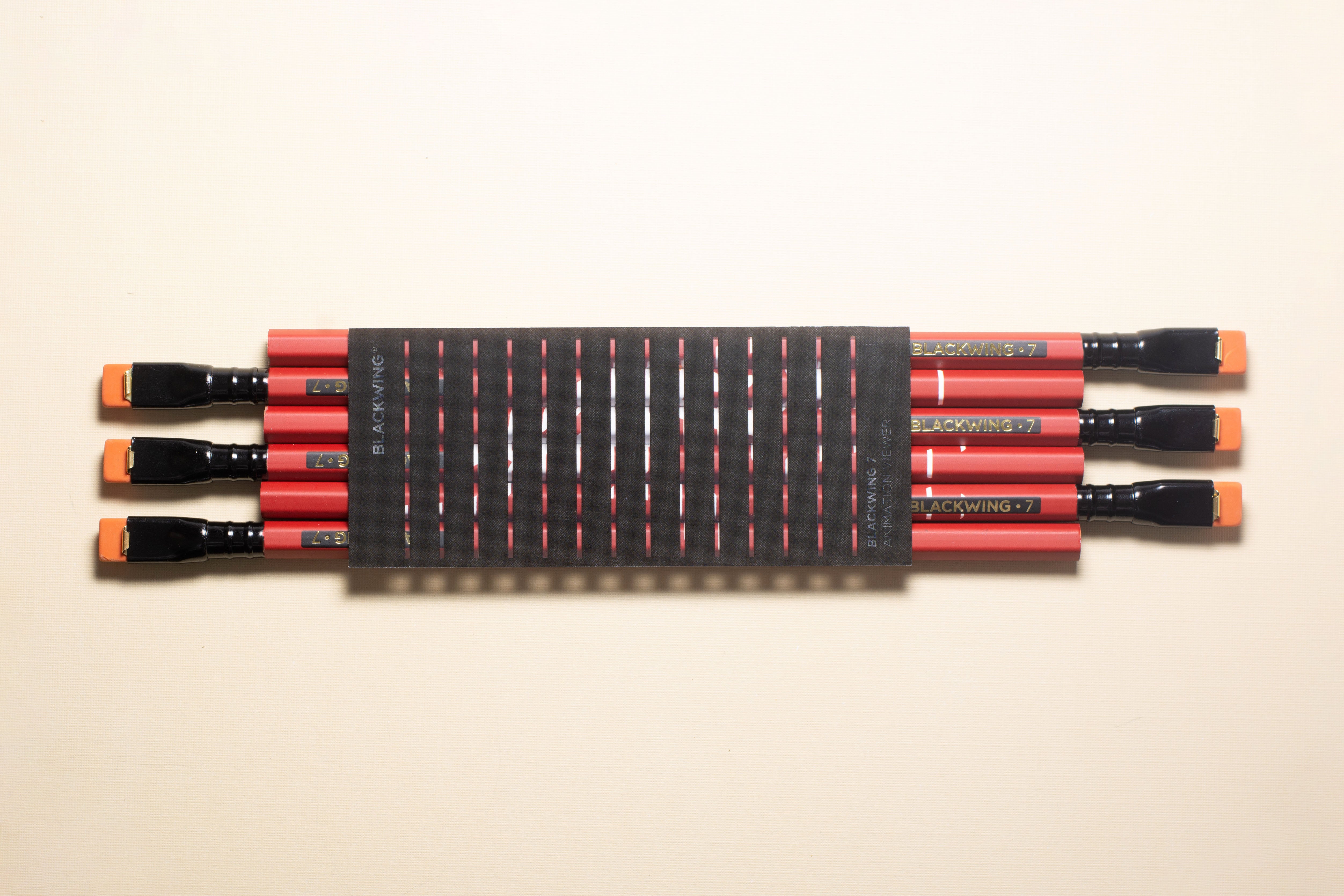 A Blackwing Volume 7 (Set of 12) brush holder sits on a white surface, perfect for organizing your pencils.