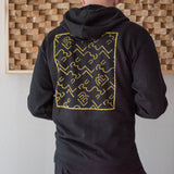The back of a man in a Blackwing Sketch Zip-up Hooded Sweatshirt from the Winter 2019 collection.