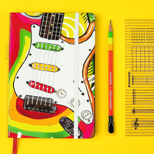 Blackwing x George Harrison Notebook on a yellow background with notebook and insert