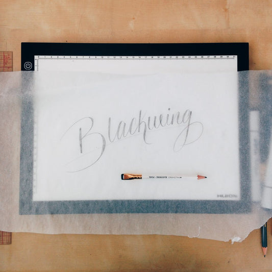 Blackwing lettering sketched on paper