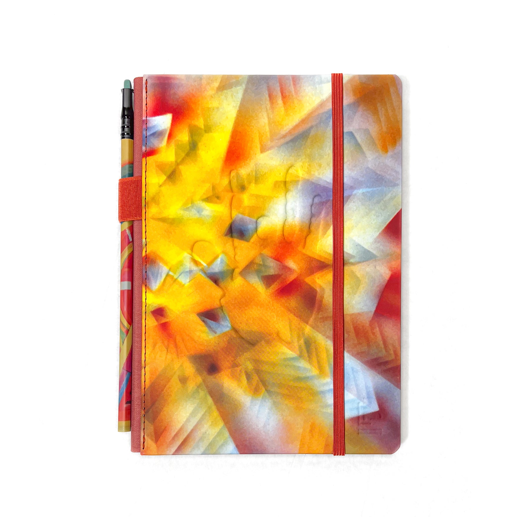 Colorful abstract-patterned Jerry Garcia limited edition journal with a Blackwing Volume 710 Slate Notebook and elastic closure.