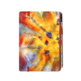 A colorful abstract-patterned Blackwing Volume 710 Slate Notebook with an elastic band closure and a pen.