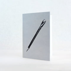 white greeting card featuring a black graphic of a blackwing pencil 