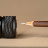 brown pencil and black sharpener