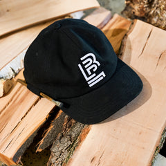 Black cap with a white Blackwing emblem embroidered on the front. A Blackwing Volume 21 pencil is looped into the side for convenience.