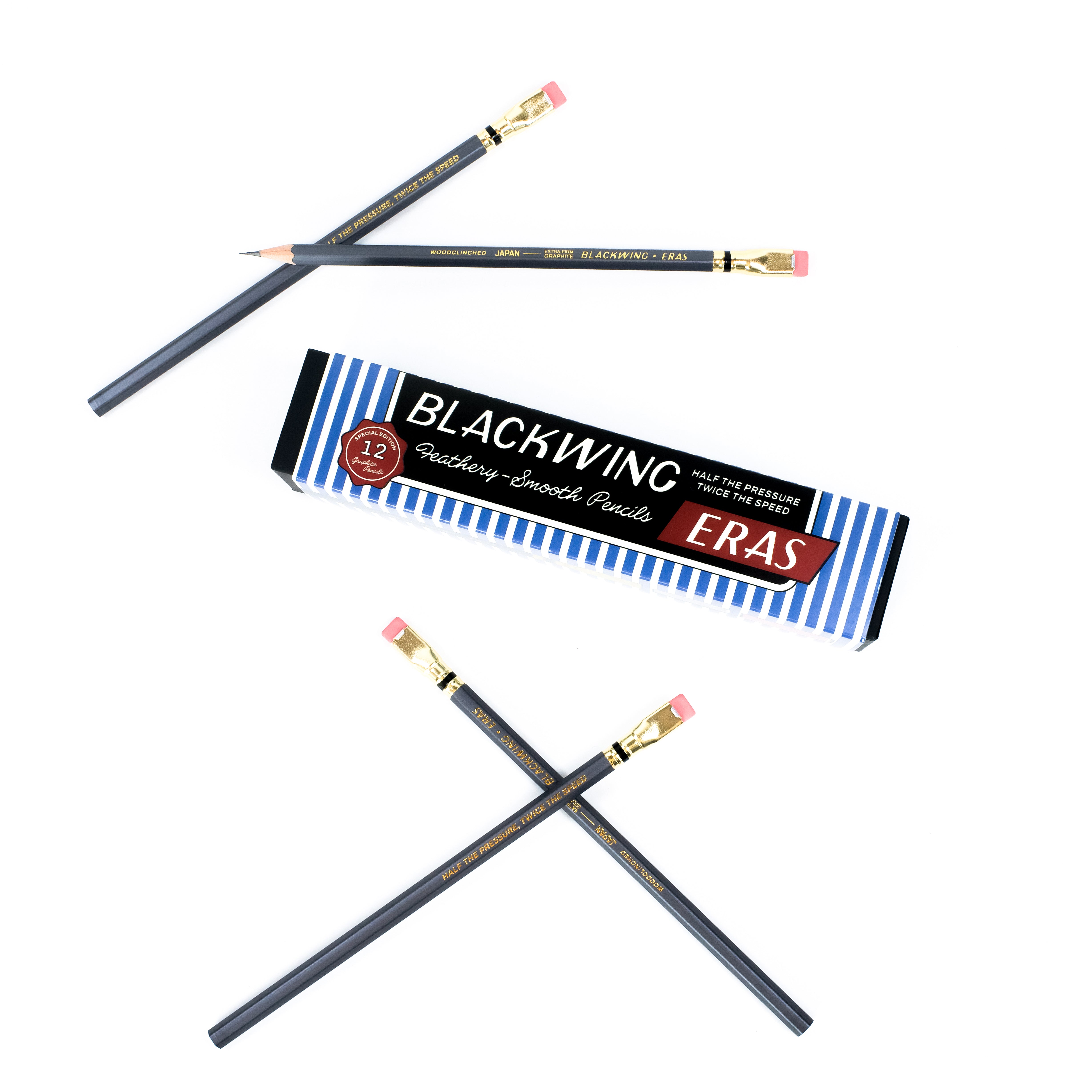 Twelve Blackwing drawing and sketching pencils with grey barrels, pink erasers, shown with their blue and white striped packaging box on a clean white background.