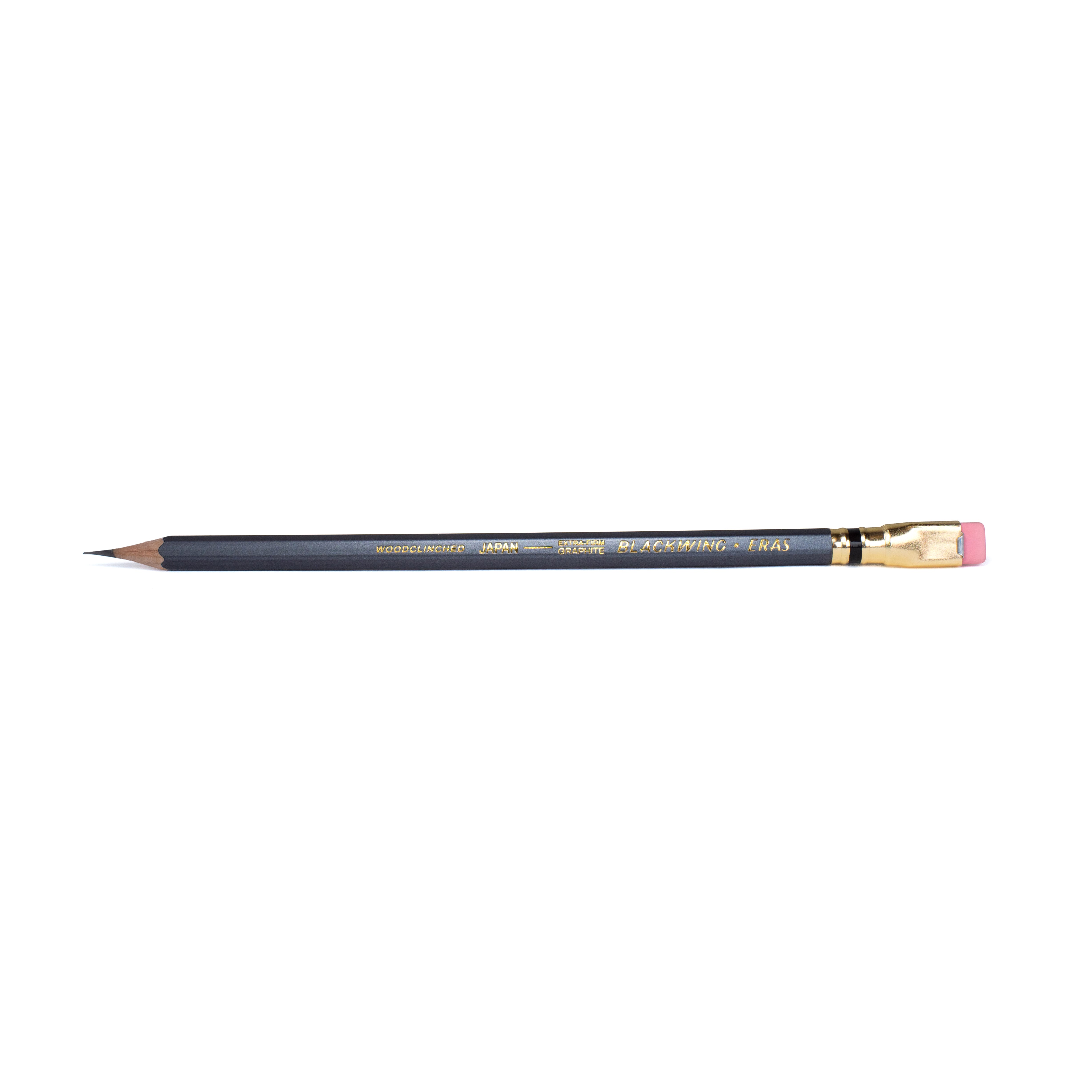 Blackwing Eras 2026 pencil features a dark grey barrel, iconic dark gold ferrule with a black stripe, pink eraser, and our extra-firm graphite, and dark gold imprint that says "WOODCLINCHED JAPAN --- EXTRA-FIRM GRAPHITE BLACKWING ERAS".
