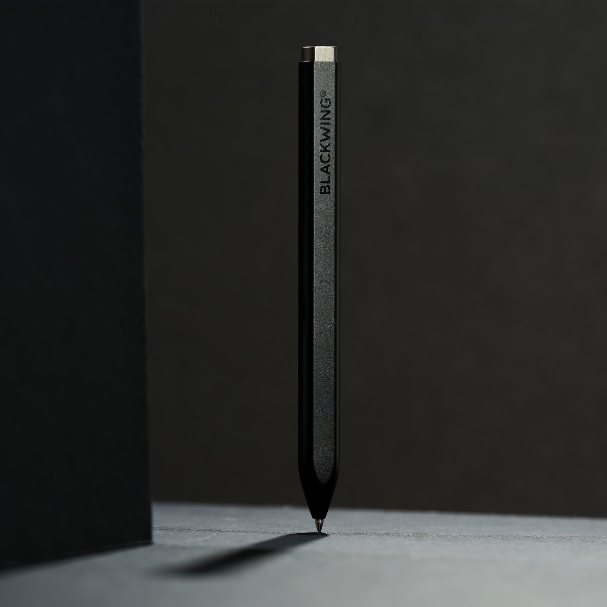 Black pen with 'BLACKWING' wordmark on a dark background