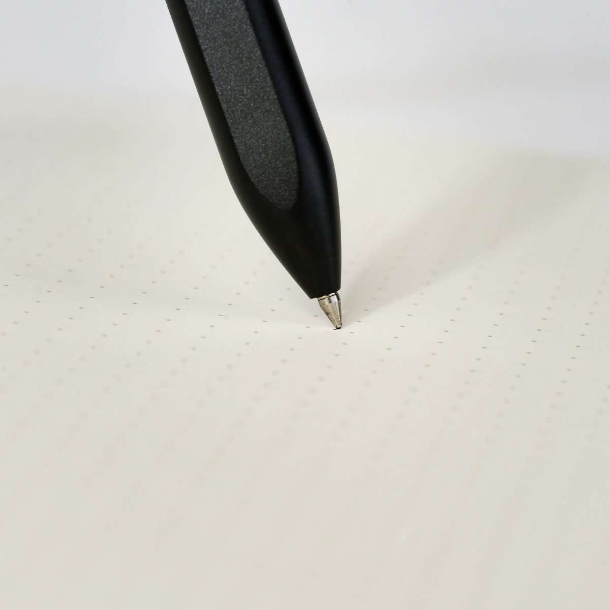 pen tip connecting with dot-grid paper